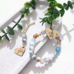 دستبند به همراه گیره روسری طرح های فاطمه زهرا (س) - رنگی